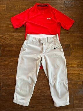 Nike men’s gray baseball pants knickers and red dri-fit t-shirt. Size small.
